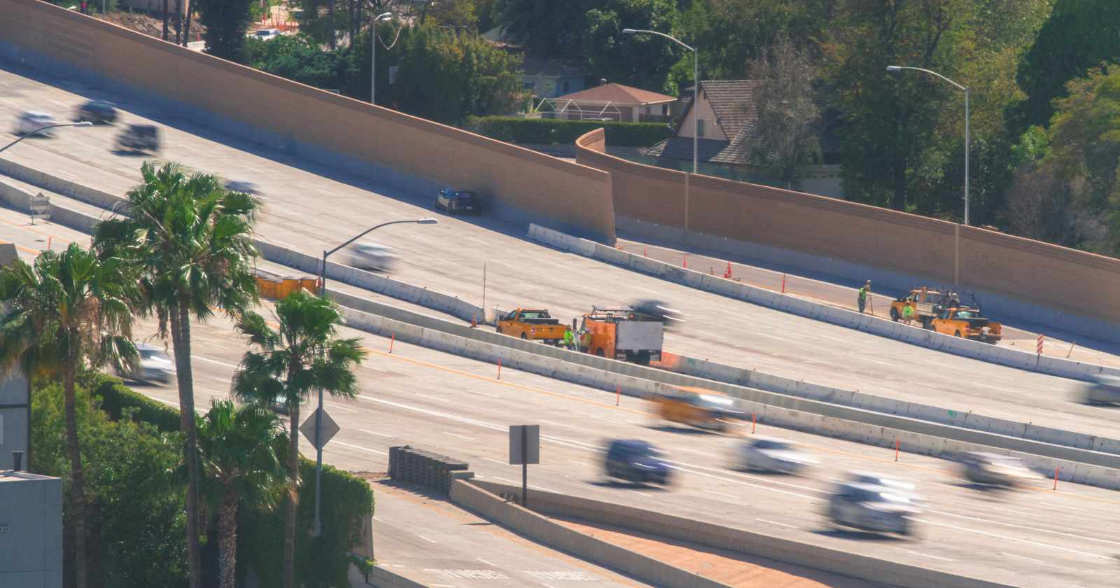 Cars driving on the 57 freeway near Anaheim Stadium.