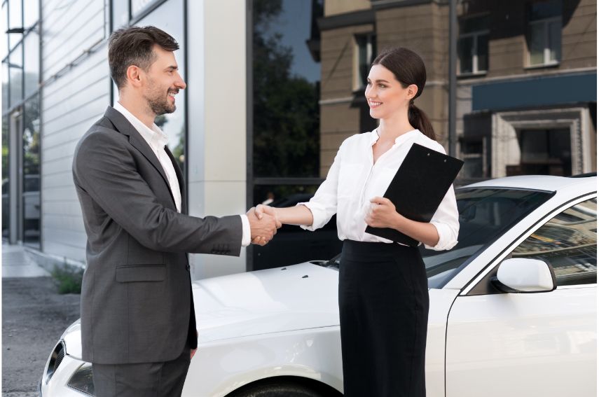 Man & Woman completing a successful loan buyout.